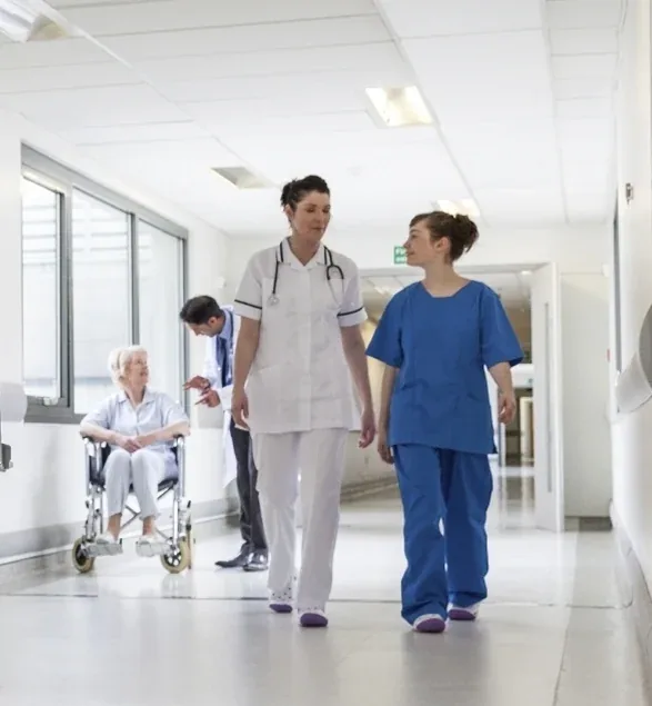Healthcare professionals in a hospital corridor